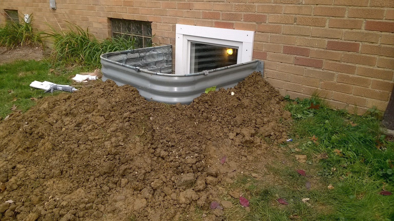 Above Ground Basement
 How far does a basement egress window well need to stick