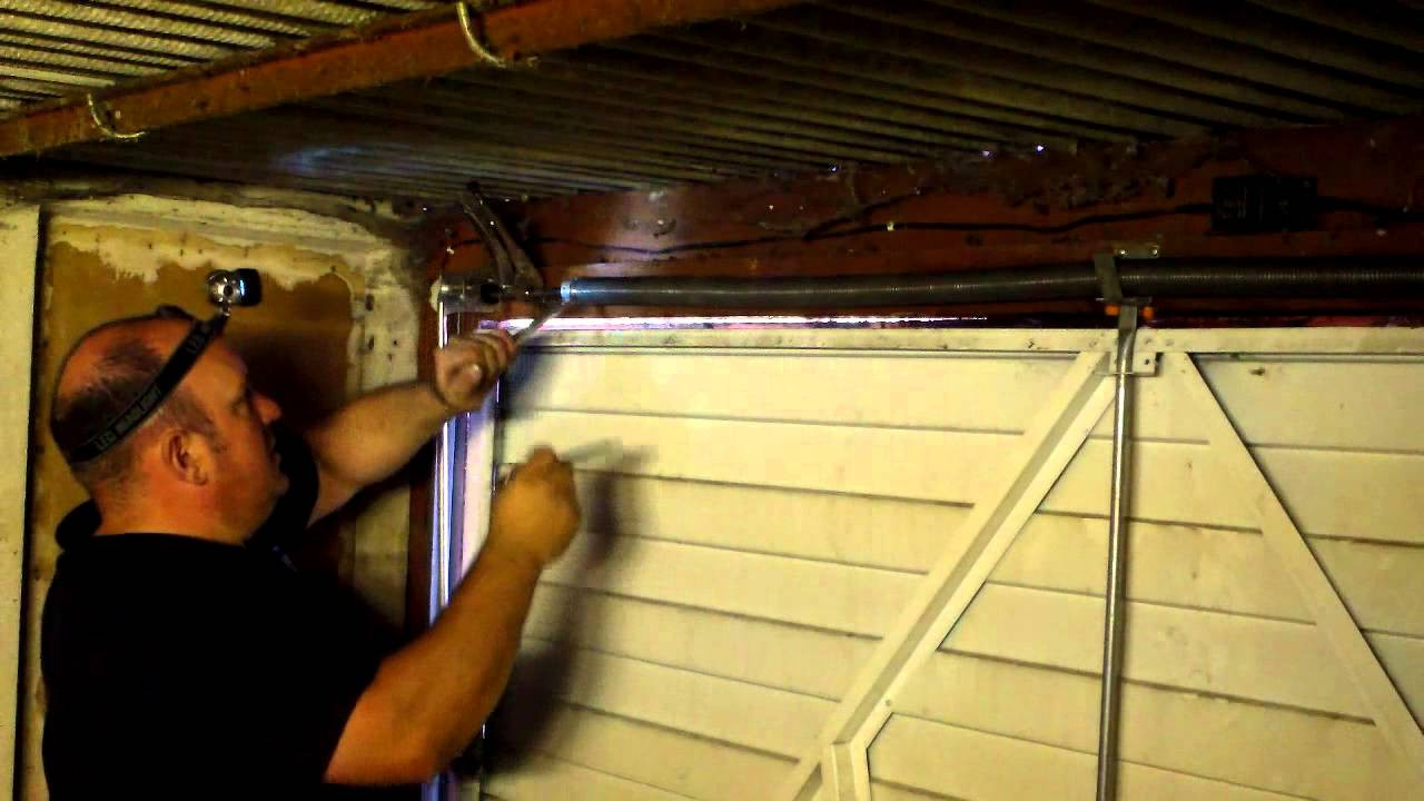 Adjusting Garage Door
 How to adjust the spring tension on a garage door in