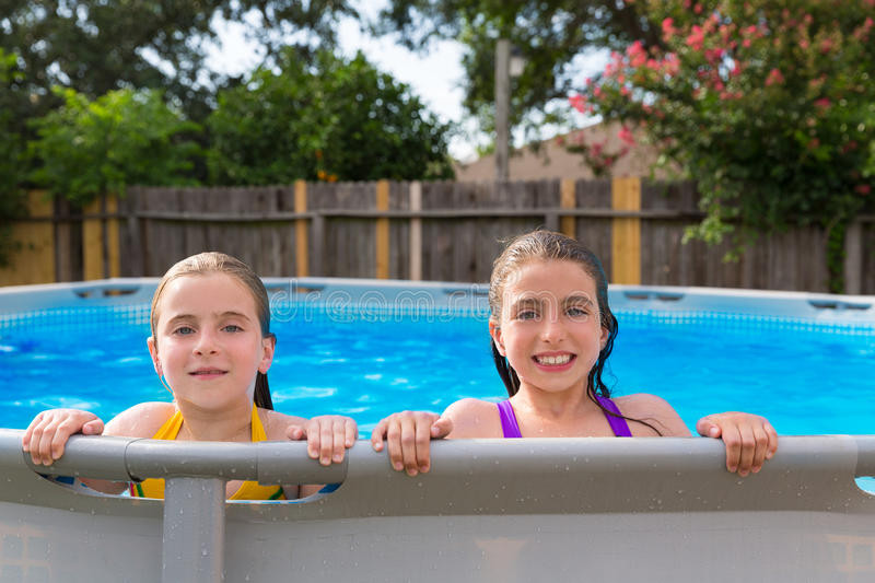 Backyard Kid Pool
 Kid Girls Swimming In The Pool In Backyard Stock Image