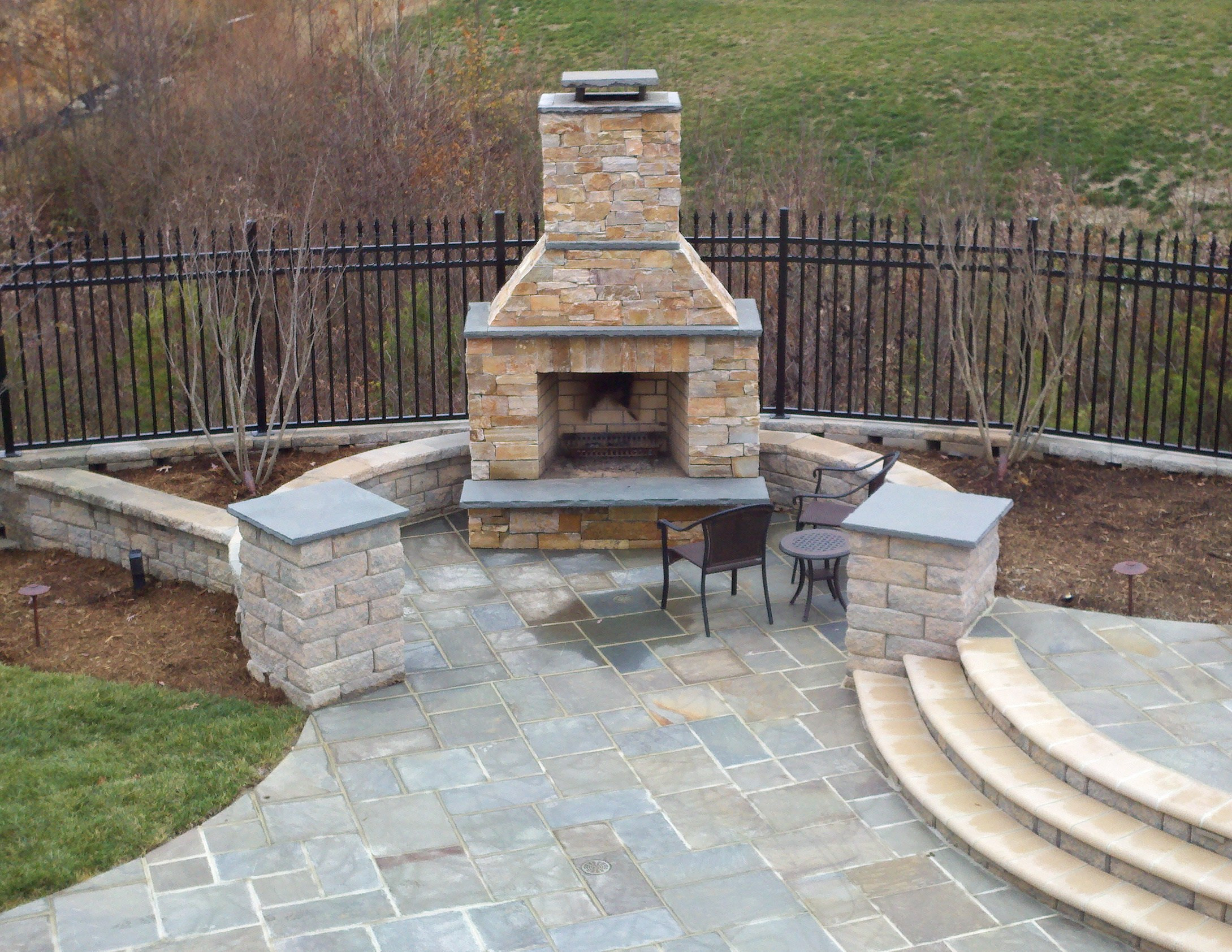 Backyard Stone Patio
 Beautiful Pool with Bluestone Patios and Stone Fireplace