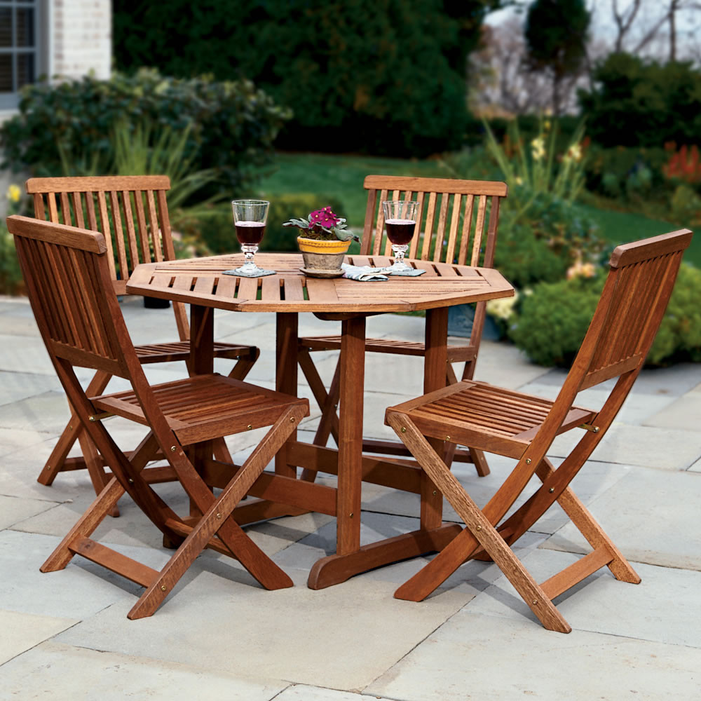 Backyard Table And Chairs
 The Trestle Patio Table and Stow Away Chairs Hammacher