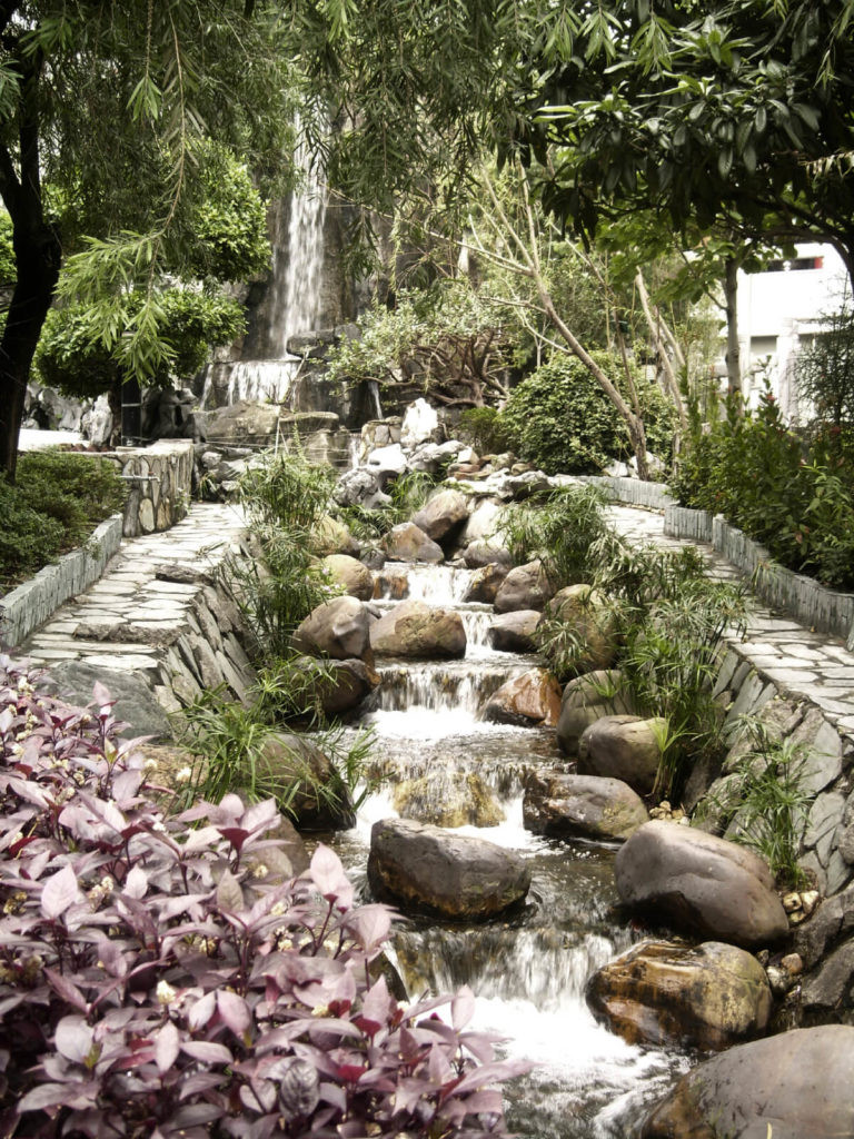 Backyard Waterfalls Ideas
 Two narrow stone paths run on either side of this multi