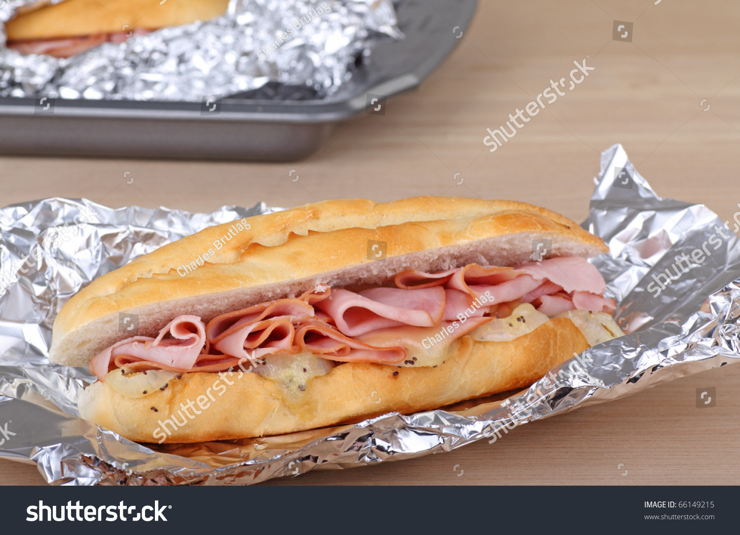 Baked Ham And Cheese Sandwiches In Foil
 Ham And Cheese Sandwich Wrapped In Aluminum Foil Stock