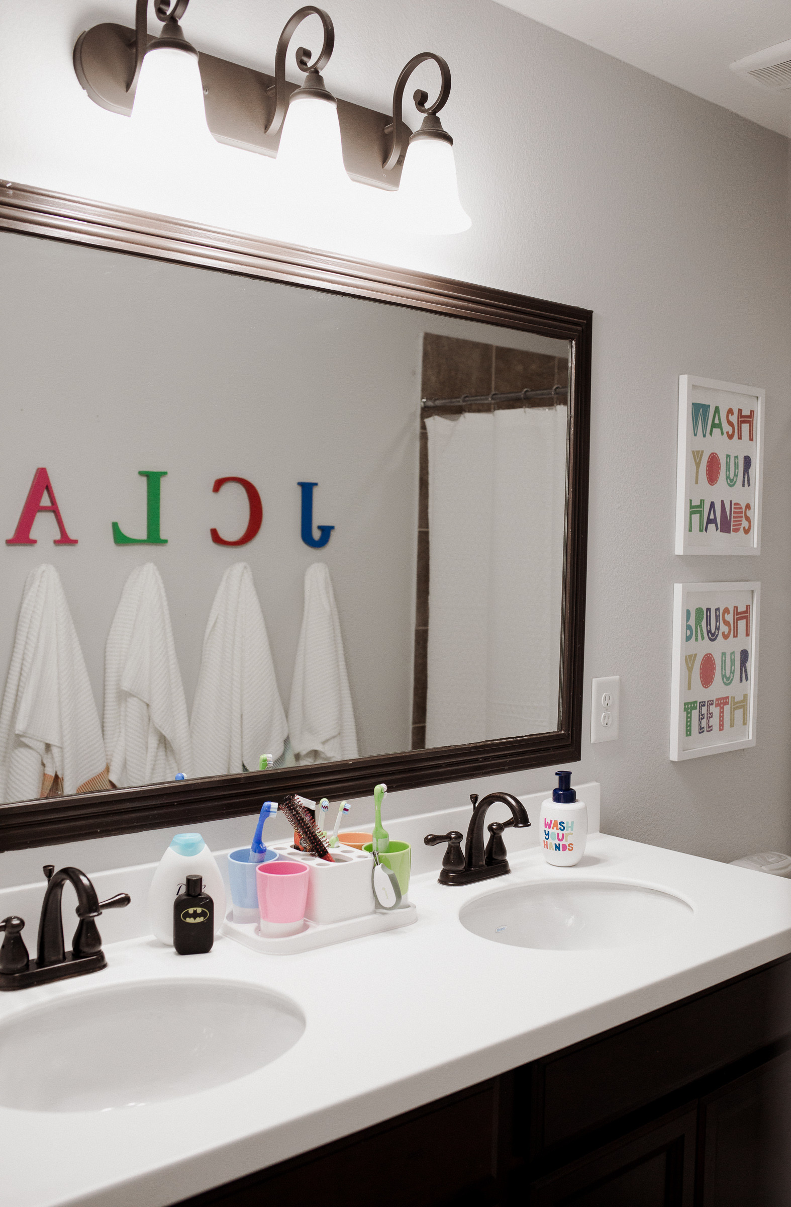 Bathroom Decor For Kids
 Our Kids d Bathroom Decor Makeover Uptown with Elly