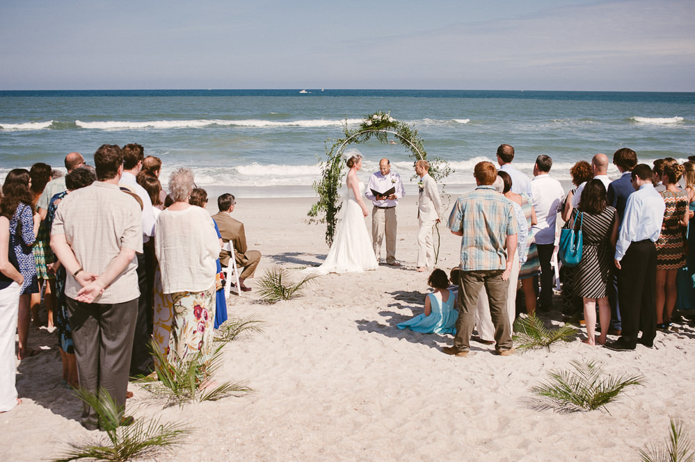 Beach Weddings In Nc
 Bride wears a strapless Watters lace wedding dress at a