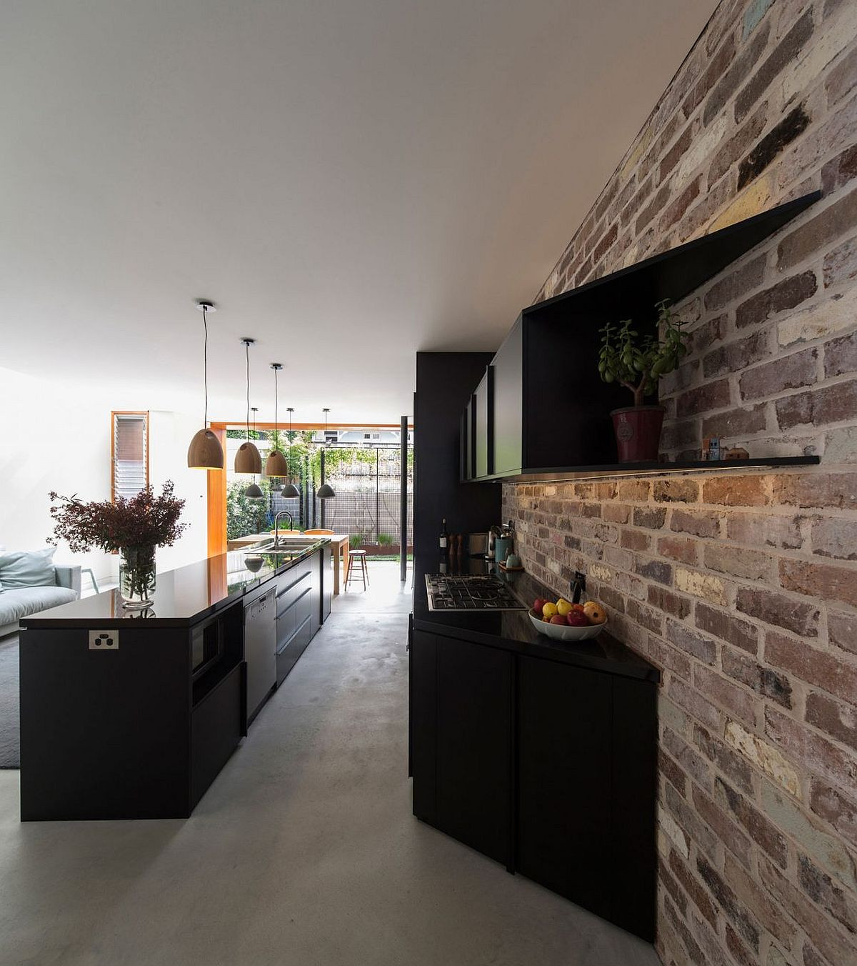 Black Kitchen Walls
 Bud Family Home in Sydney Uses Reclaimed Bricks