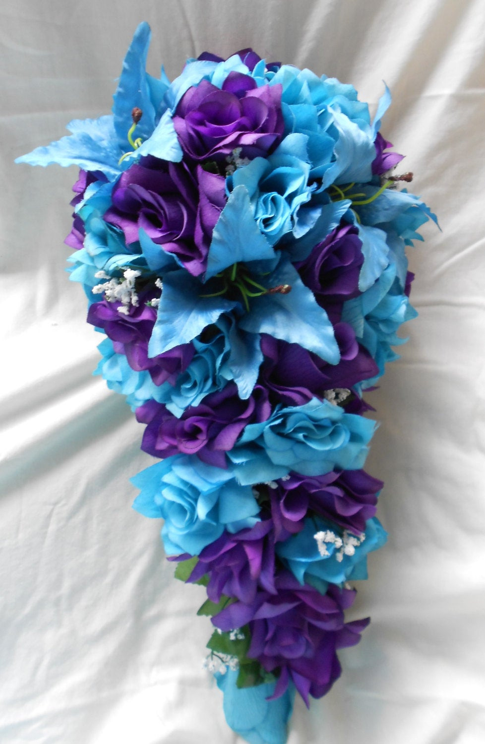 Blue And Purple Wedding Flowers
 Purple and Turquoise Blue cascade wedding bouquet lilies and