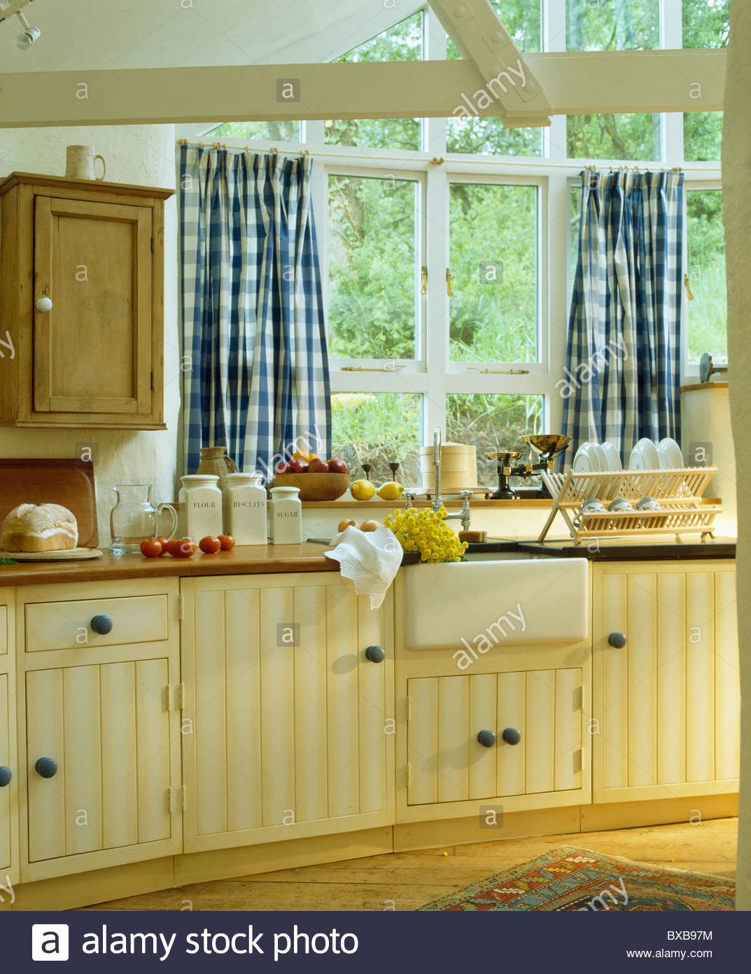 Blue And White Kitchen Curtains
 Blue white checked curtains on window above sink in