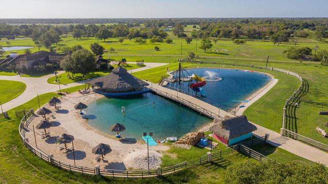 Cecil Backyard Waterpark
 e of a kind Houston area home with water park like lake