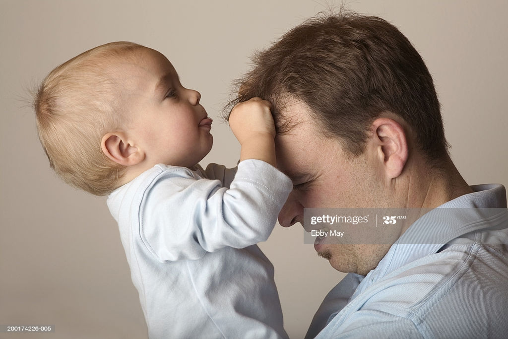 Child Pulling Hair Out
 Baby Boy Pulling Fathers Hair Profile Stock