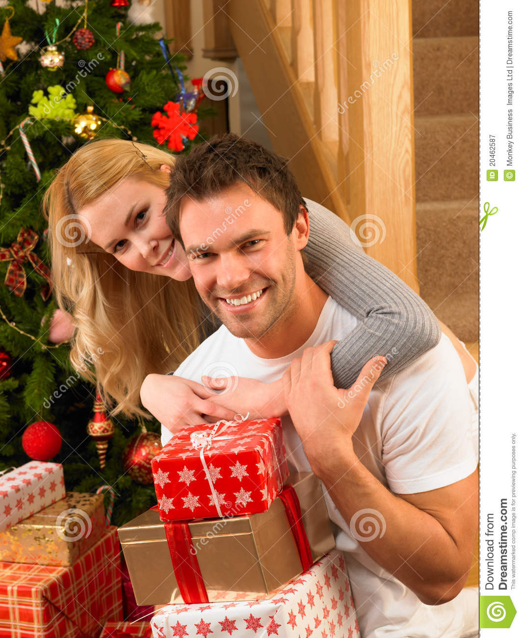 Christmas Gift Ideas Young Couple
 Young Couple At Christmas Exchanging Gifts Royalty Free