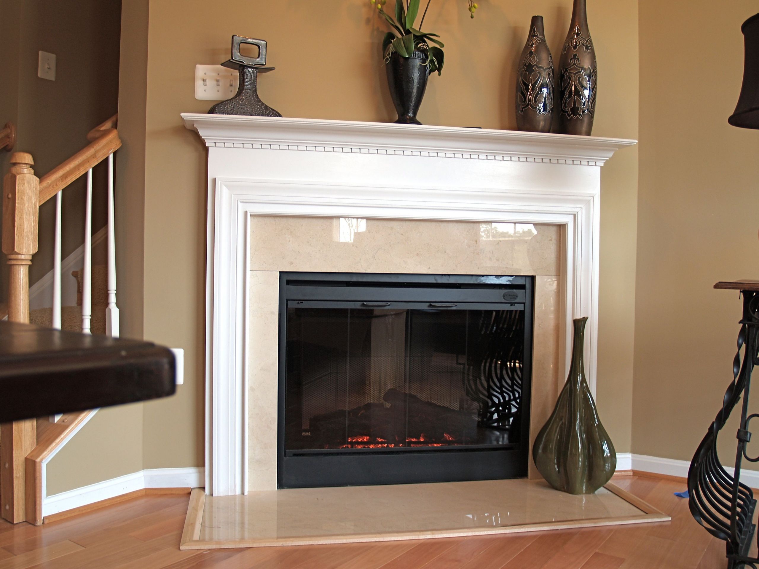 Electric Fireplace With Stone Surround
 Classic mantel shown with Crema Marfil marble and electric