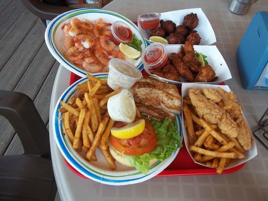 Key Largo Fisheries Backyard
 Dining on their deck Picture of Key Largo Fisheries