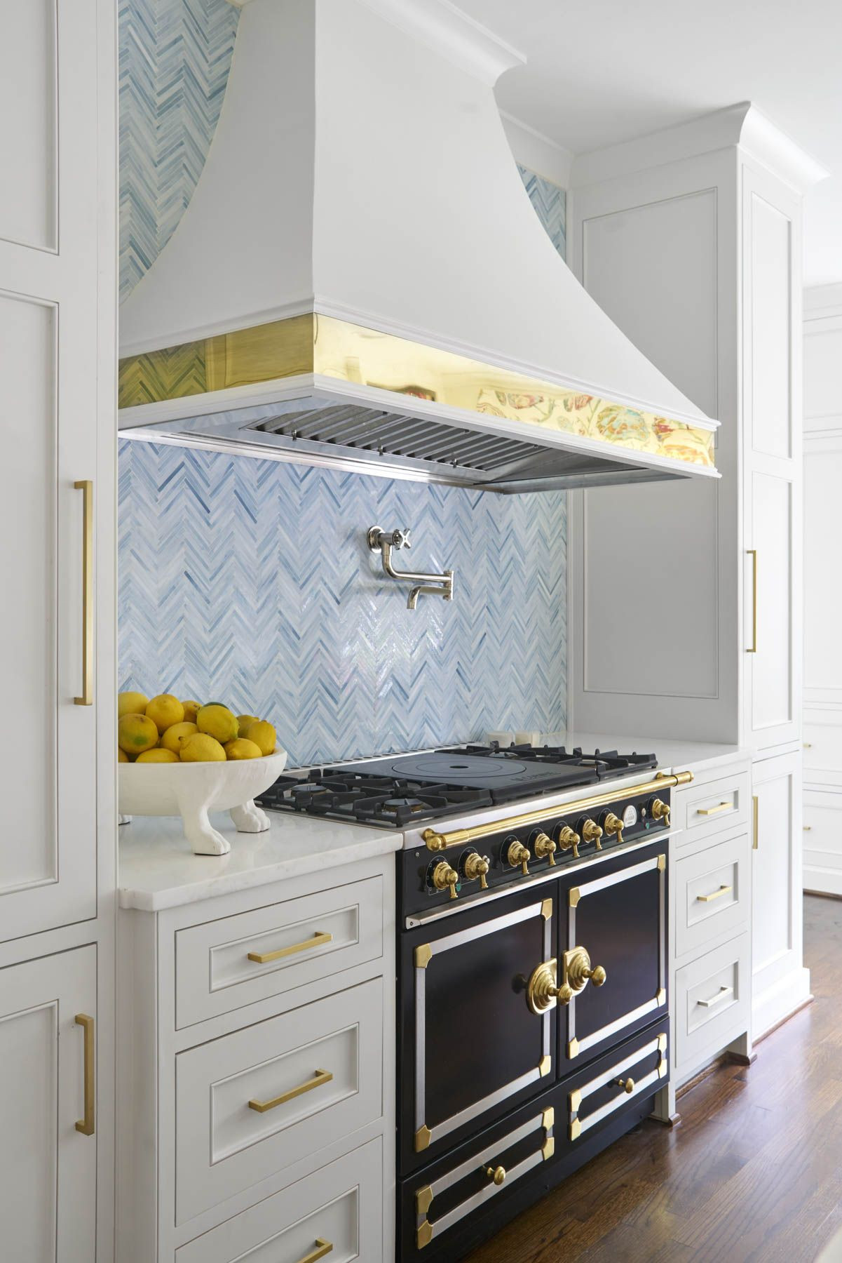 Light Blue Kitchen Backsplash
 light and bright kitchen with white cabinets and brass