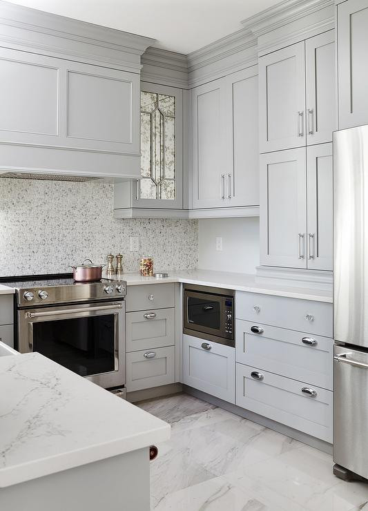 Marble Kitchen Floor
 Gray Shaker KItchen Cabinets with Engineered White Quartz