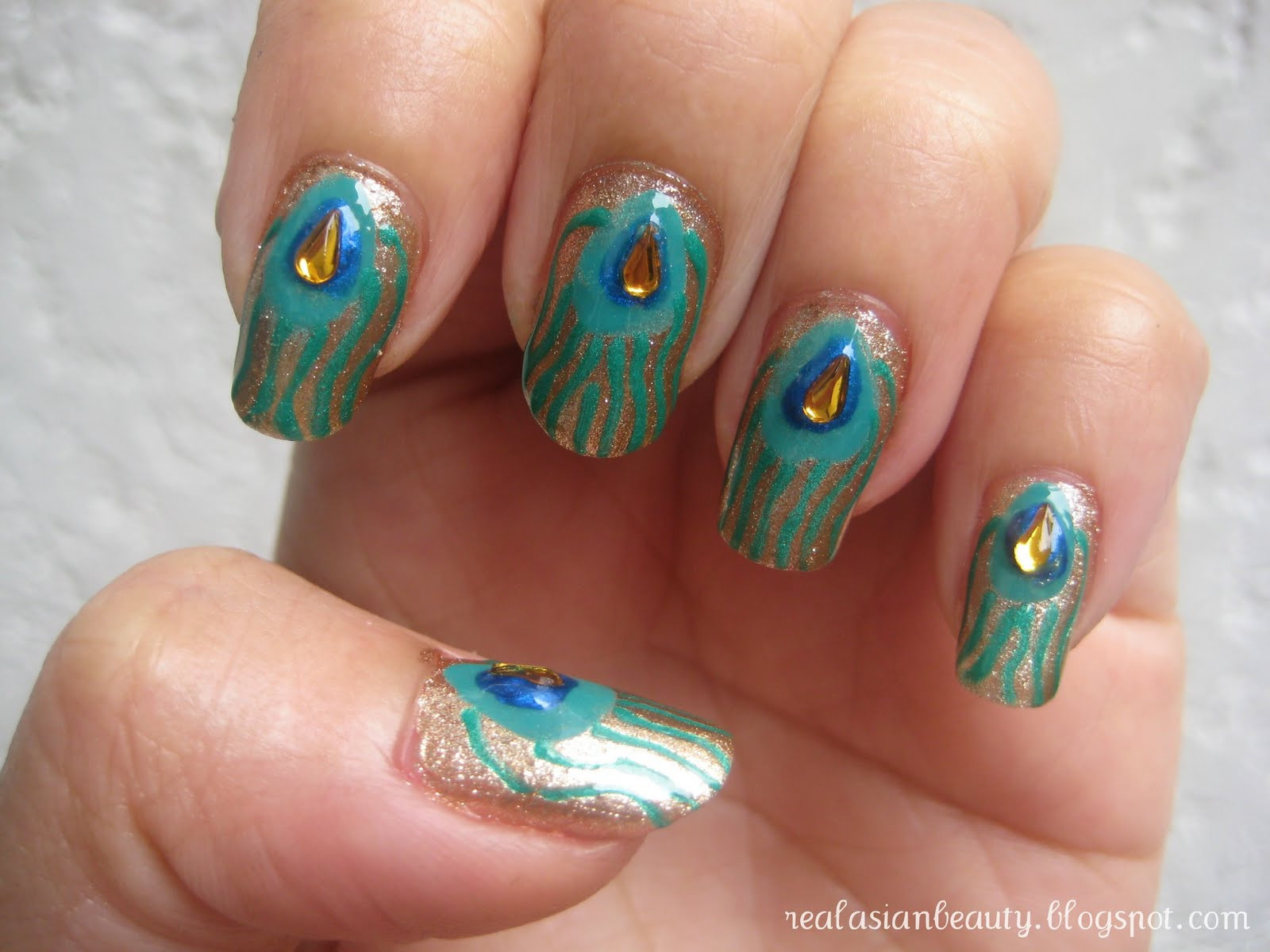 Peacock Feather Nail Art
 Real Asian Beauty Peacock Feather Inspired Nail Art