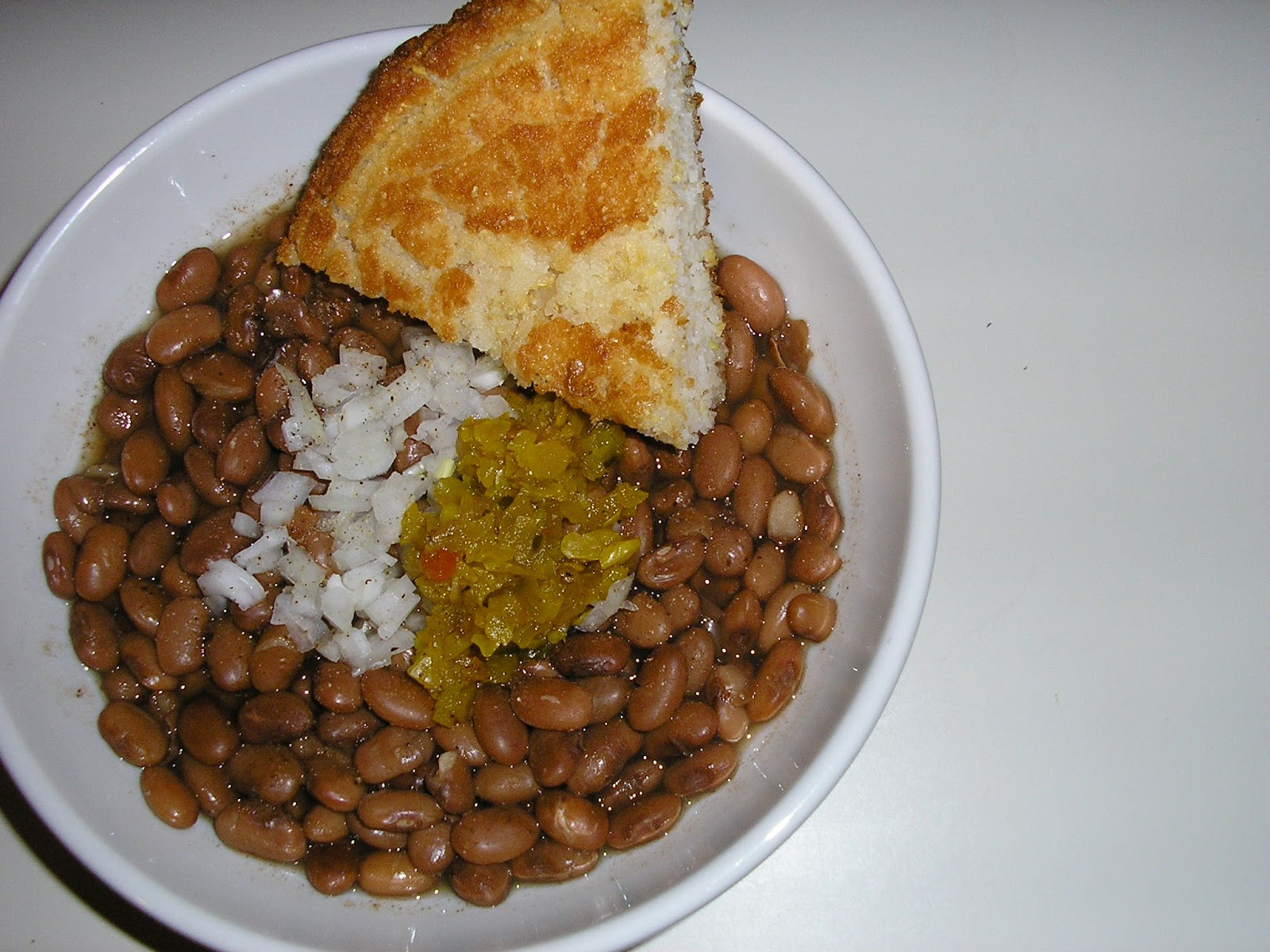Pinto Beans And Cornbread
 Fatback and Foie Gras Brown Beans Cornbread and