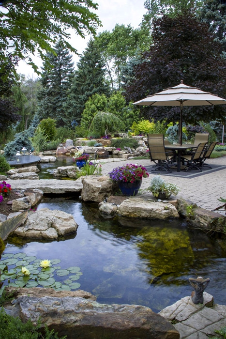 Pond In Backyard
 Create a Paradise with a Backyard Pond Town & Country Living