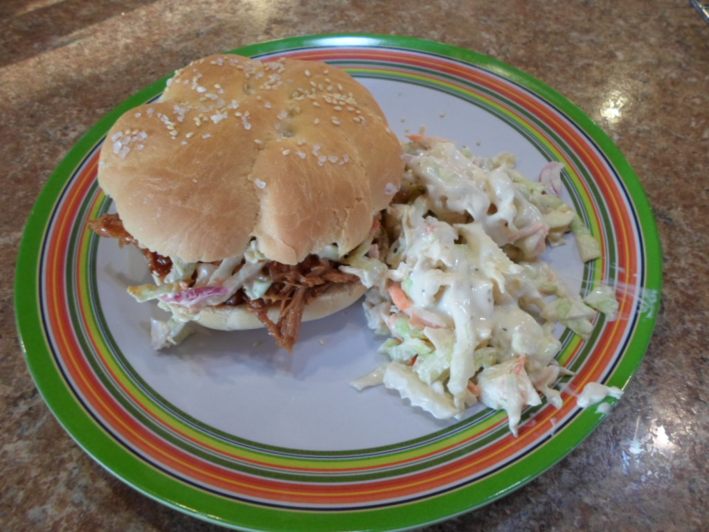 Pulled Pork Sandwiches Sides
 Pulled pork sandwich with a side of slaw