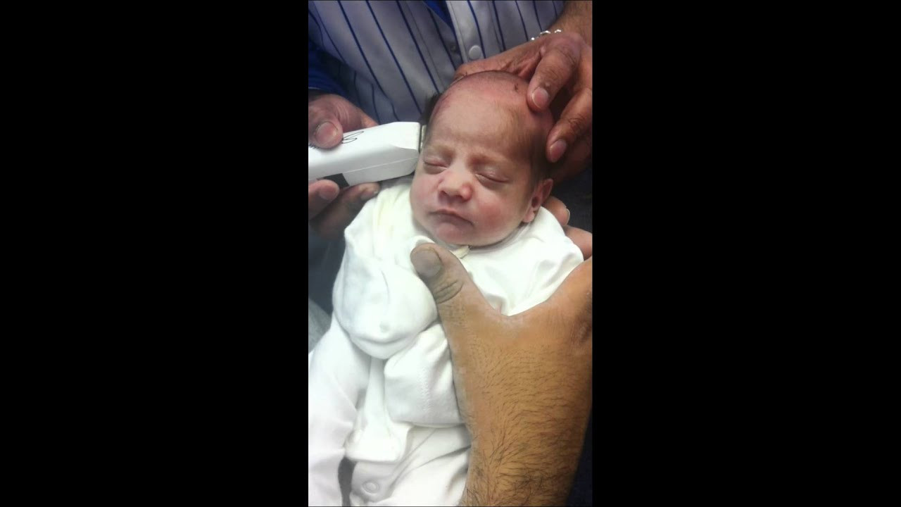 Shaving Baby Hair
 muslim baby having head shaved