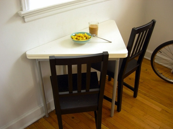 Small White Kitchen Table
 A triangle dining table – the convenience of the unusual shape