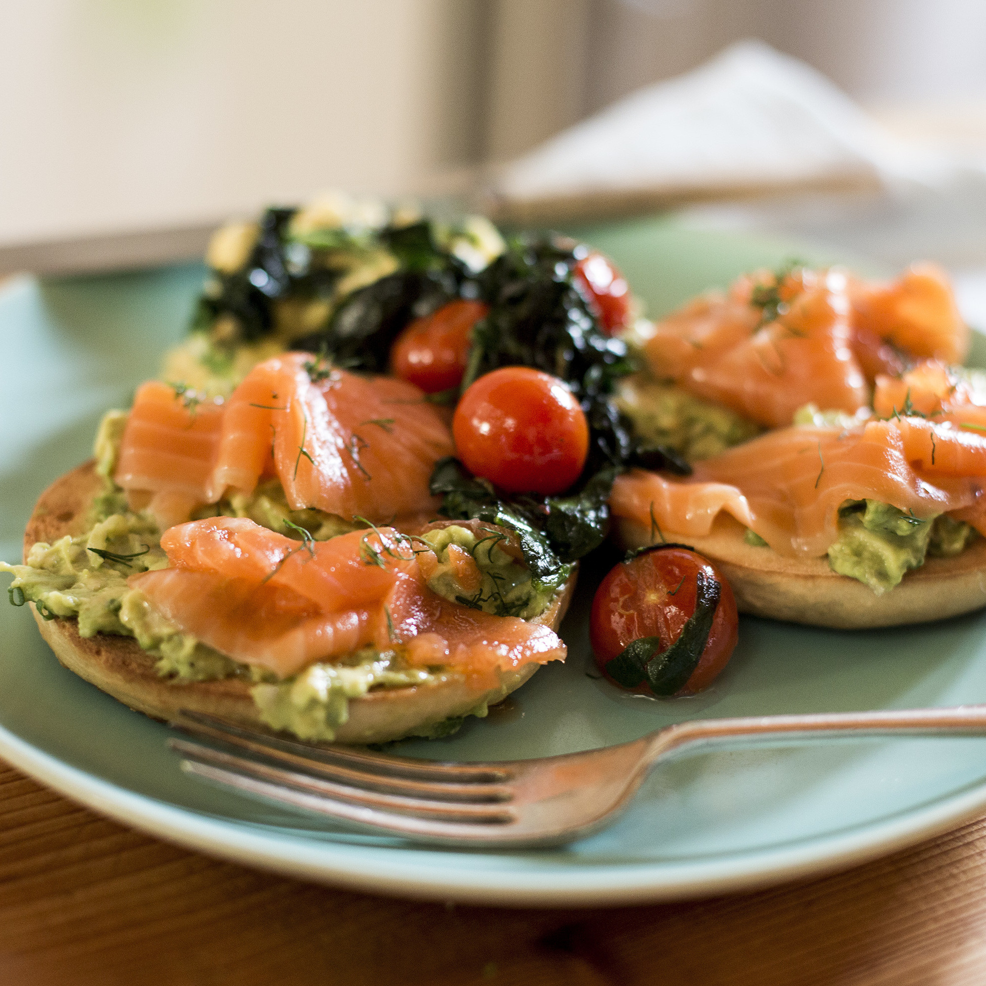 Smoked Salmon Bagel
 Smoked Salmon Bagel Crushed Avocado Tomatoes Spinach