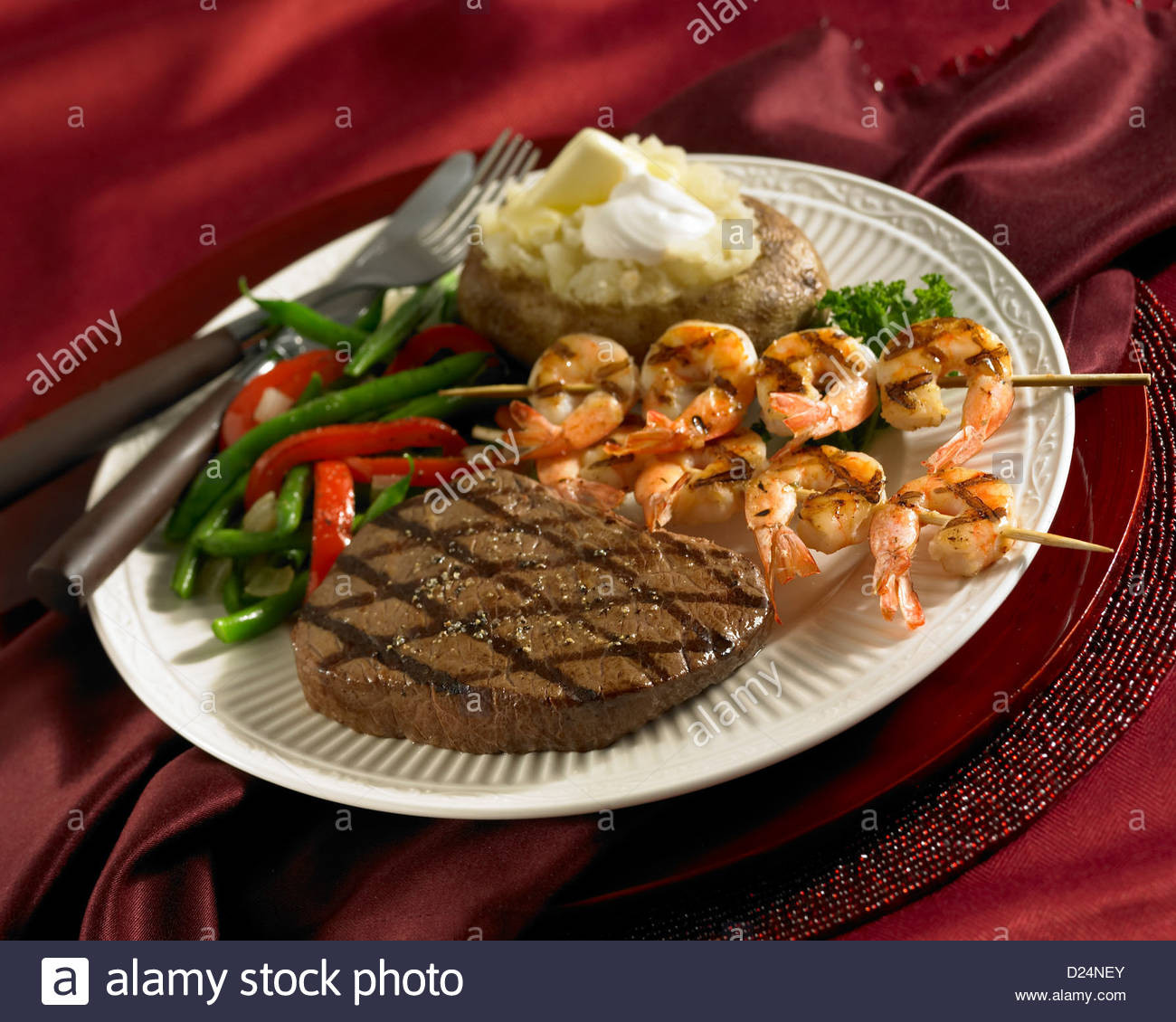 Steak And Shrimp Dinners
 Steak and shrimp skewer dinner with loaded baked potato