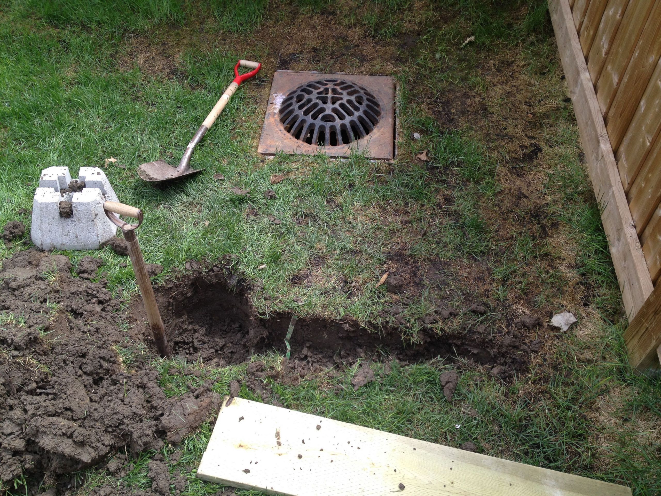 Storm Drain In Backyard
 Hiding a storm drain catch basin