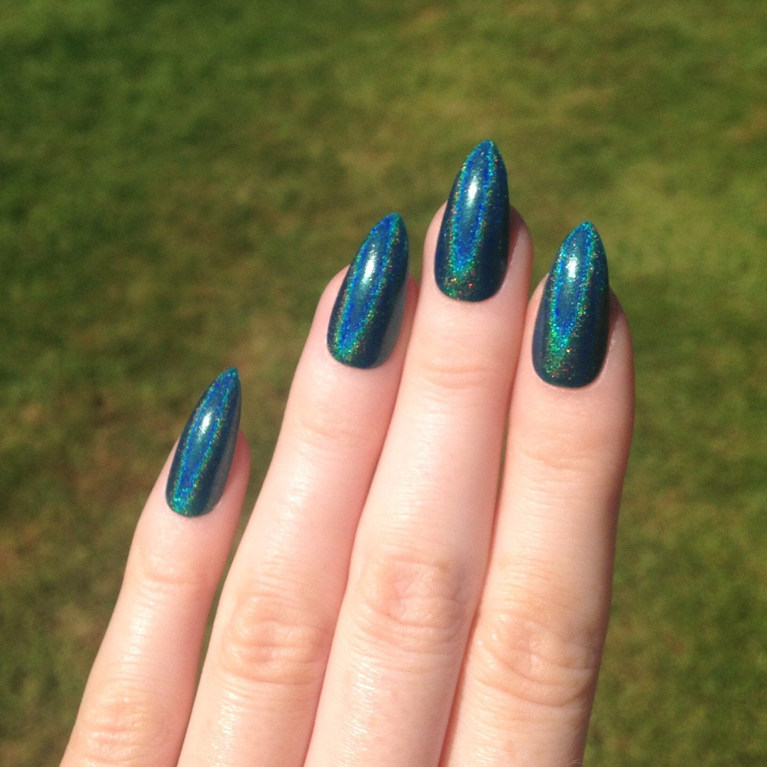 Teal Nail Designs
 Holographic teal stiletto nails Nail designs by