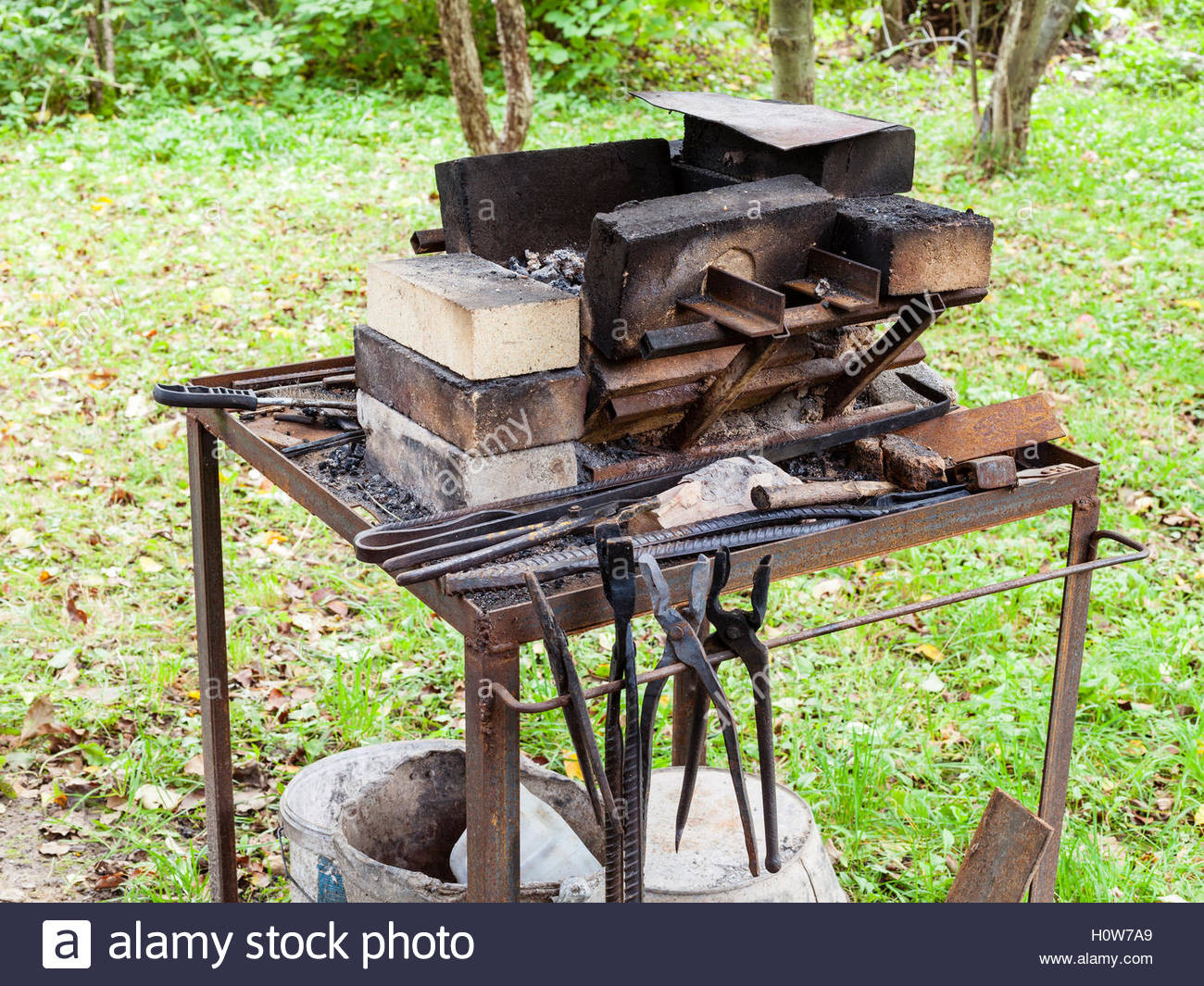 The Backyard Blacksmith
 forge of country outdoor blacksmith on backyard Stock