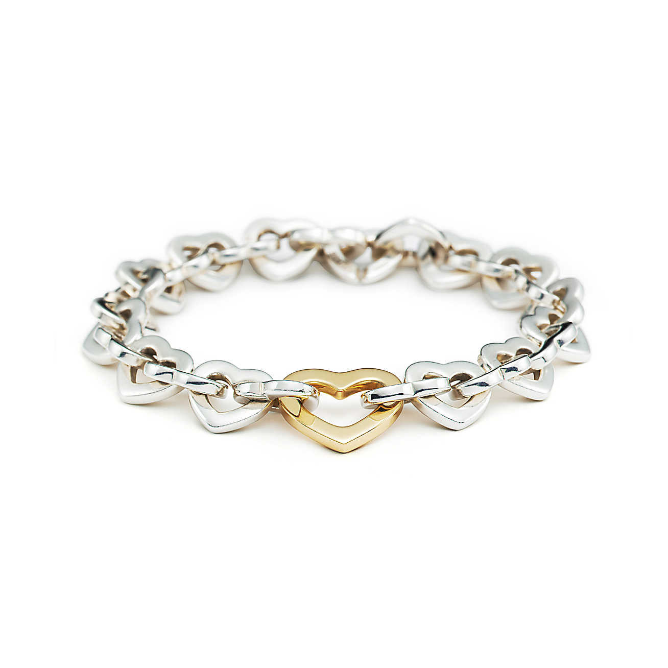 Tiffany Heart Link Bracelet
 Heart Link bracelet in sterling silver with 18k gold